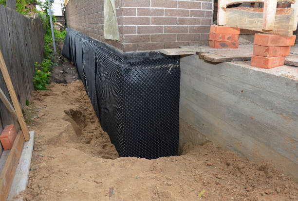 Happy homeowners after waterproofing job in Remington